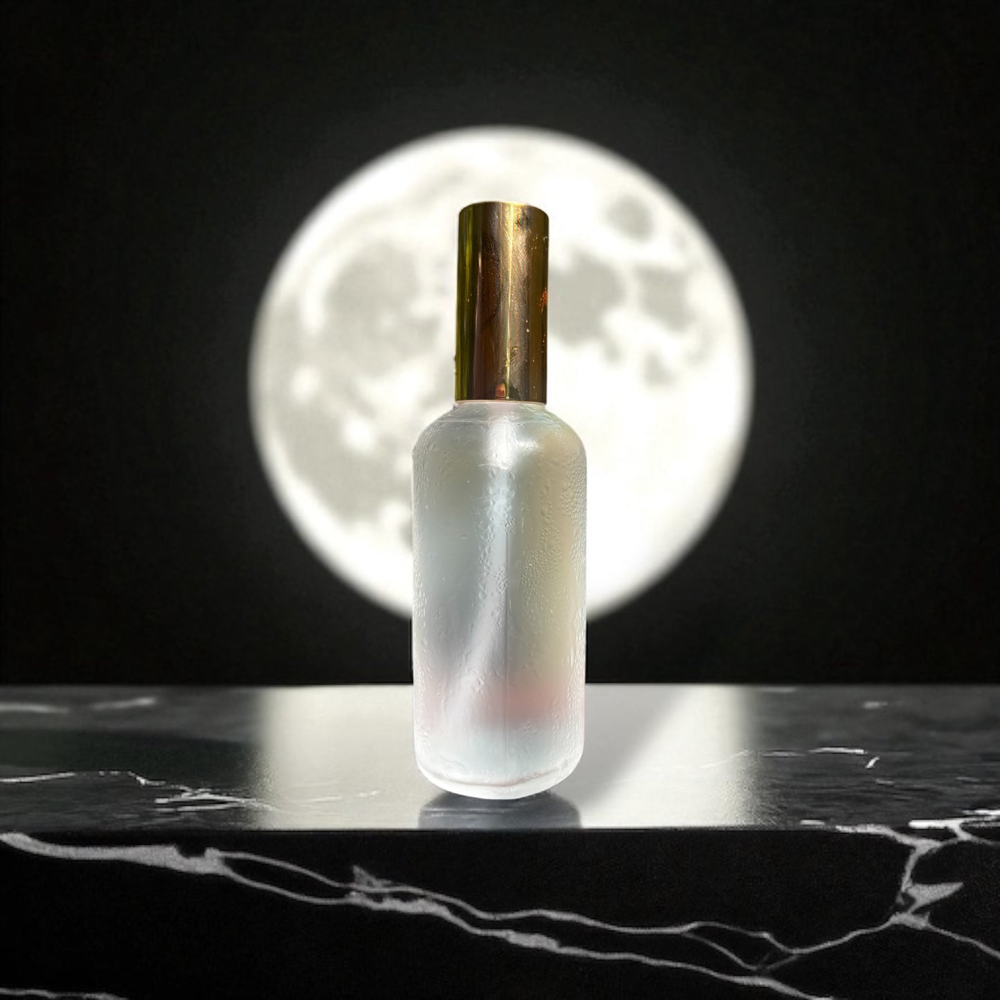 Frosted glass bottle with gold cap on a dark surface, moonlit background